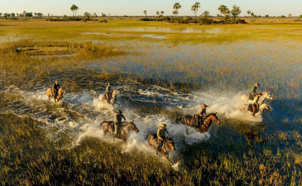 Crossing the river on horseback