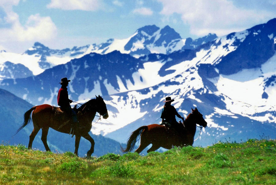 Horsemen and snowy mountains